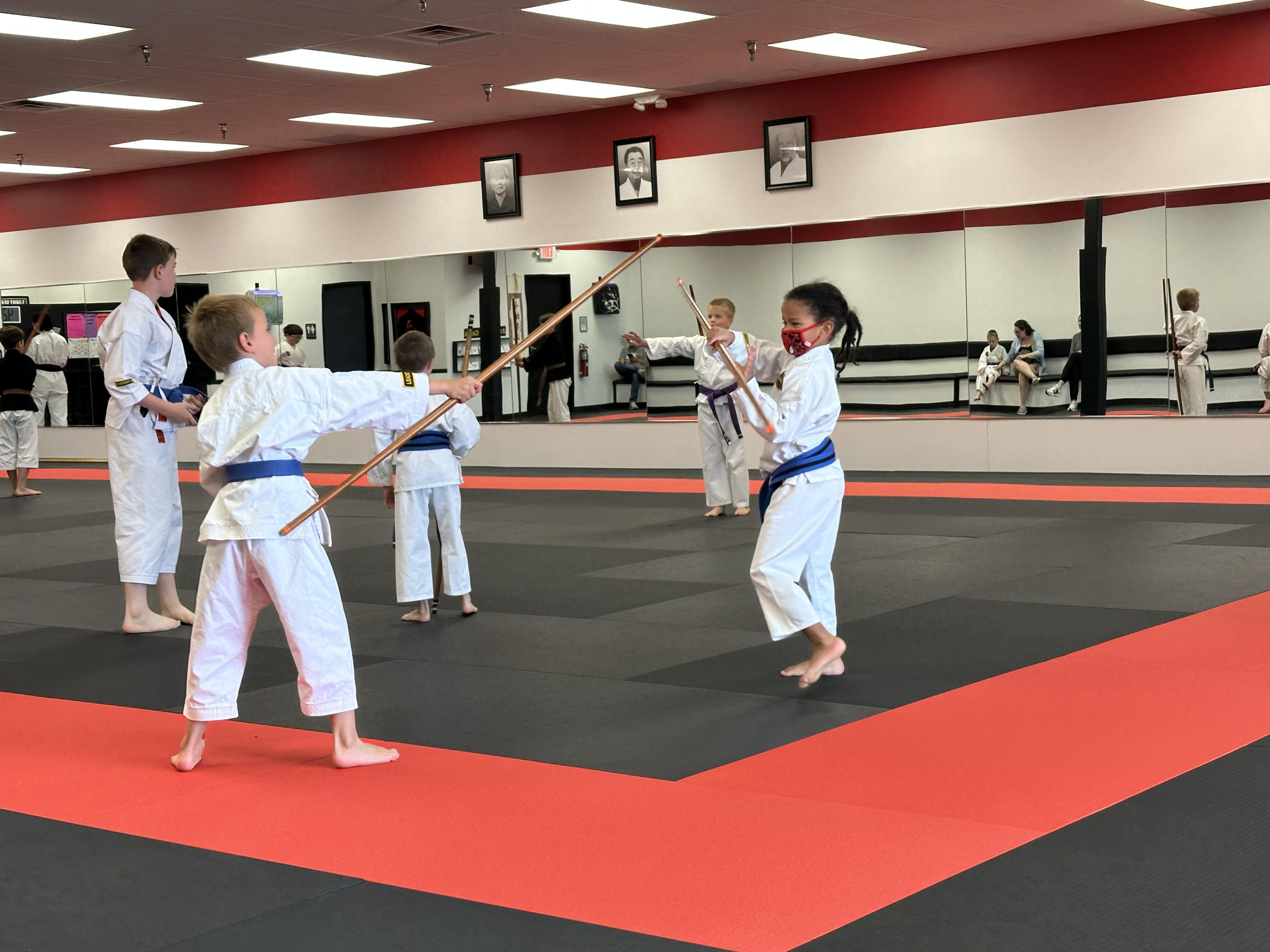 Liam practicing bo techniques