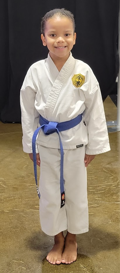 Liam posing before a karate tournament